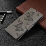 Peněženkové kožené pouzdro Embossing Two Butterflies pro Samsung Galaxy A71 - Šedá
